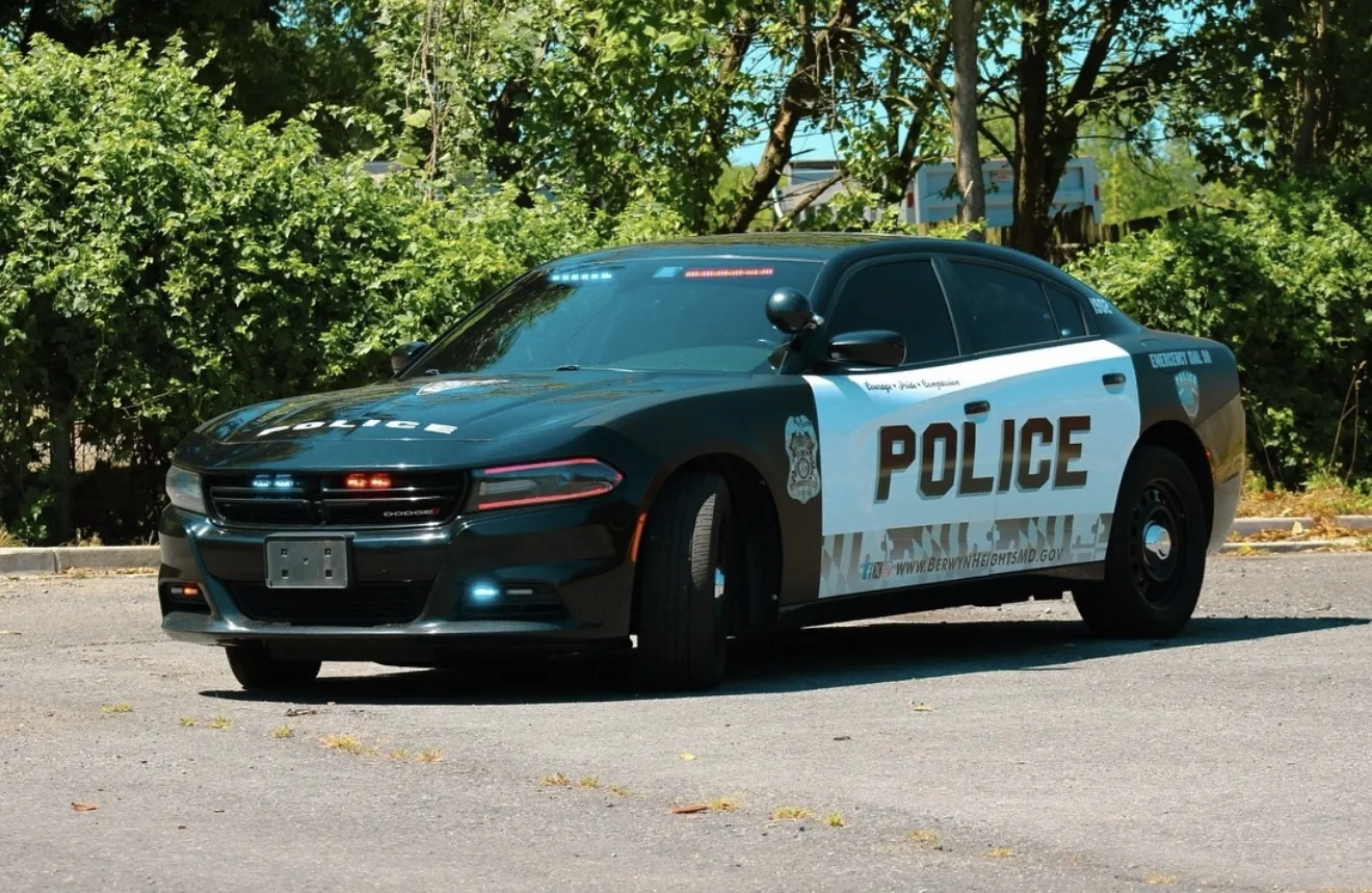 Berwyn Heights police Dodge Charger with a black and white POLICE wrap and Maryland flag pattern