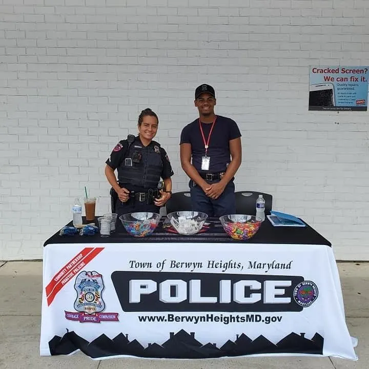 Police table cover with a town seal at an outreach event