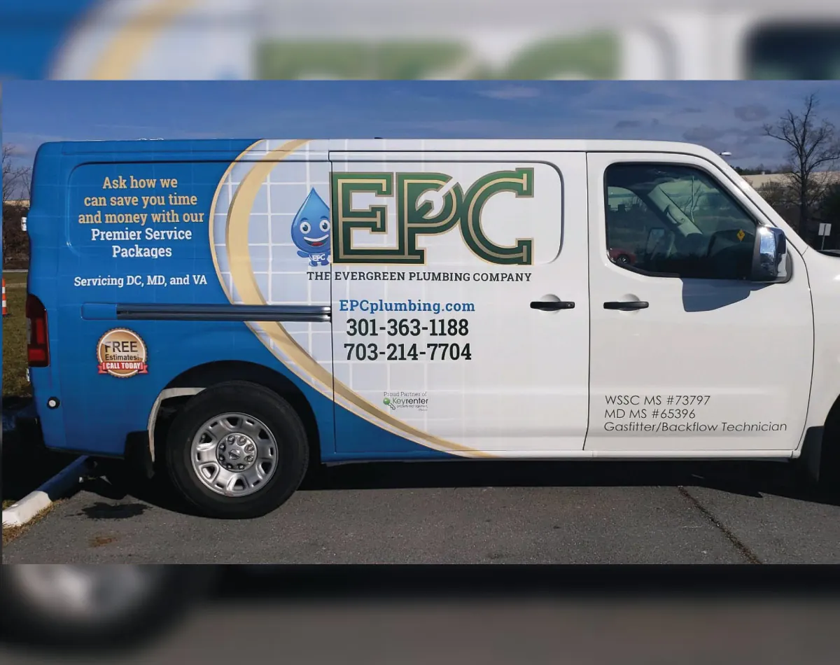 White plumbing van with a blue and gold wrap