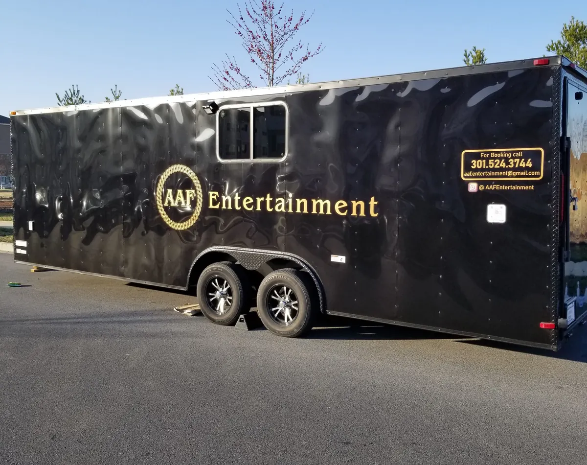Black enclosed trailer with gold lettering